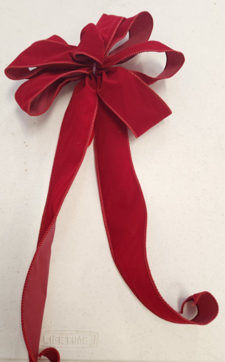 Hand-tied red velvet wreath ribbon